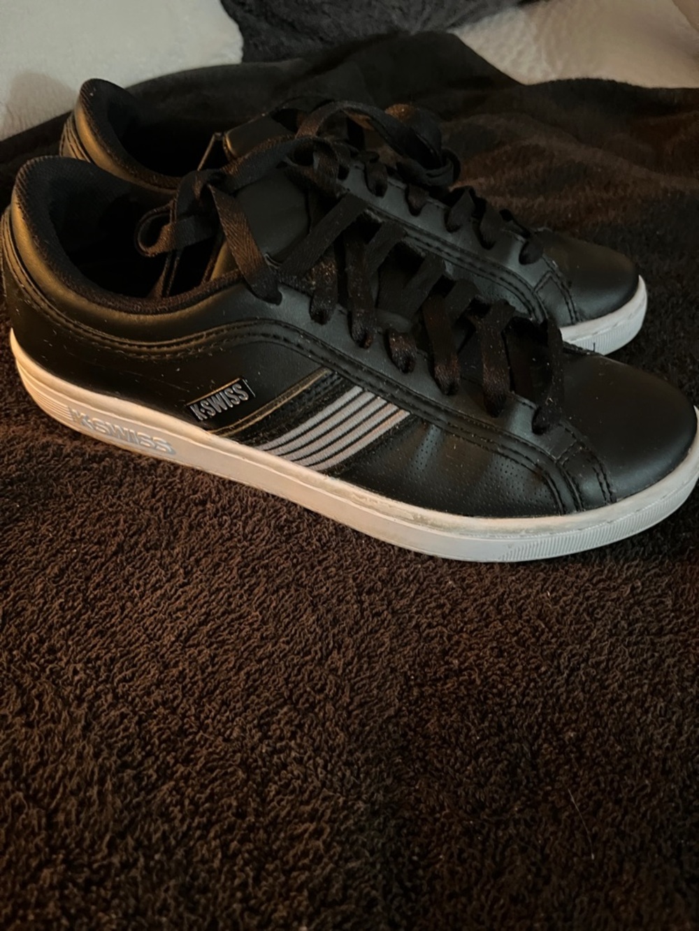 K-Swiss Big kids Black Leather Sneakers with White Sole.